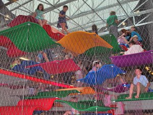 Children playing on "flying carpets" crafted from polyonyx+